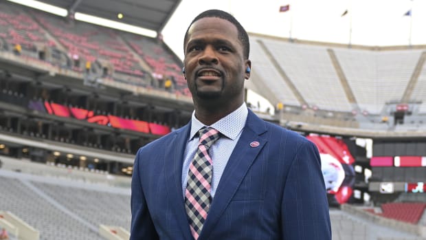 Razorbacks defensive coordinator Travis Williams walking Bryant-Denny Stadium before matchup with Alabama.